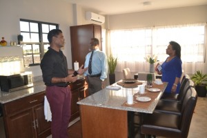 CEO of Windsor Estates Danny Sawh explaining features of the company’s model home to Prime Minister Samuel Hinds and Mrs. Yvonne Hinds.