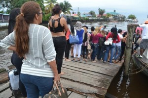 The alleged victims boarding a boat at the Bartica Stelling for their journey to Georgetown