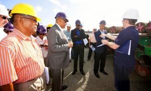 Minister of Natural Resources, Mr. Raphael Trotman; Minister of Public Infrastructure, Mr. David Patterson; Minister of Business, Mr. Dominic Gaskin; and other representatives pay keen attention to an ExxonMobil’s representative, during a tour of the oil company’s storage facility at the Wieting & Richter Wharf