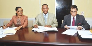 Chairman of the Commission Sir Richard Cheltenham [centre) and fellow commissioners Seenath Jairam (left) and Jacqueline Samuels-Brown 