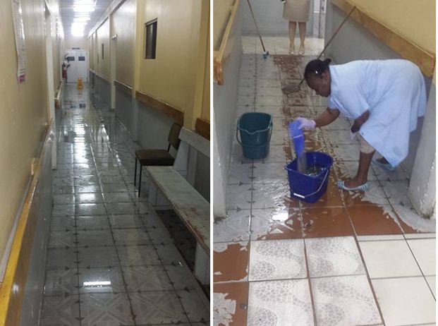 A woman is seen cleaning up the flooded areas at the Diamond Hospital this morning 