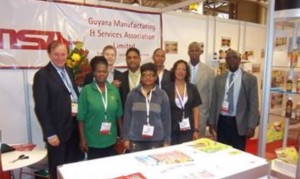 GMSA’s Co-ordinator for Trade & Investment, Clement Duncan (right) with the Guyanese exhibitors at the SIAL 2011 trade show in Toronto